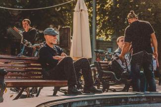 Man sitting on bench in park